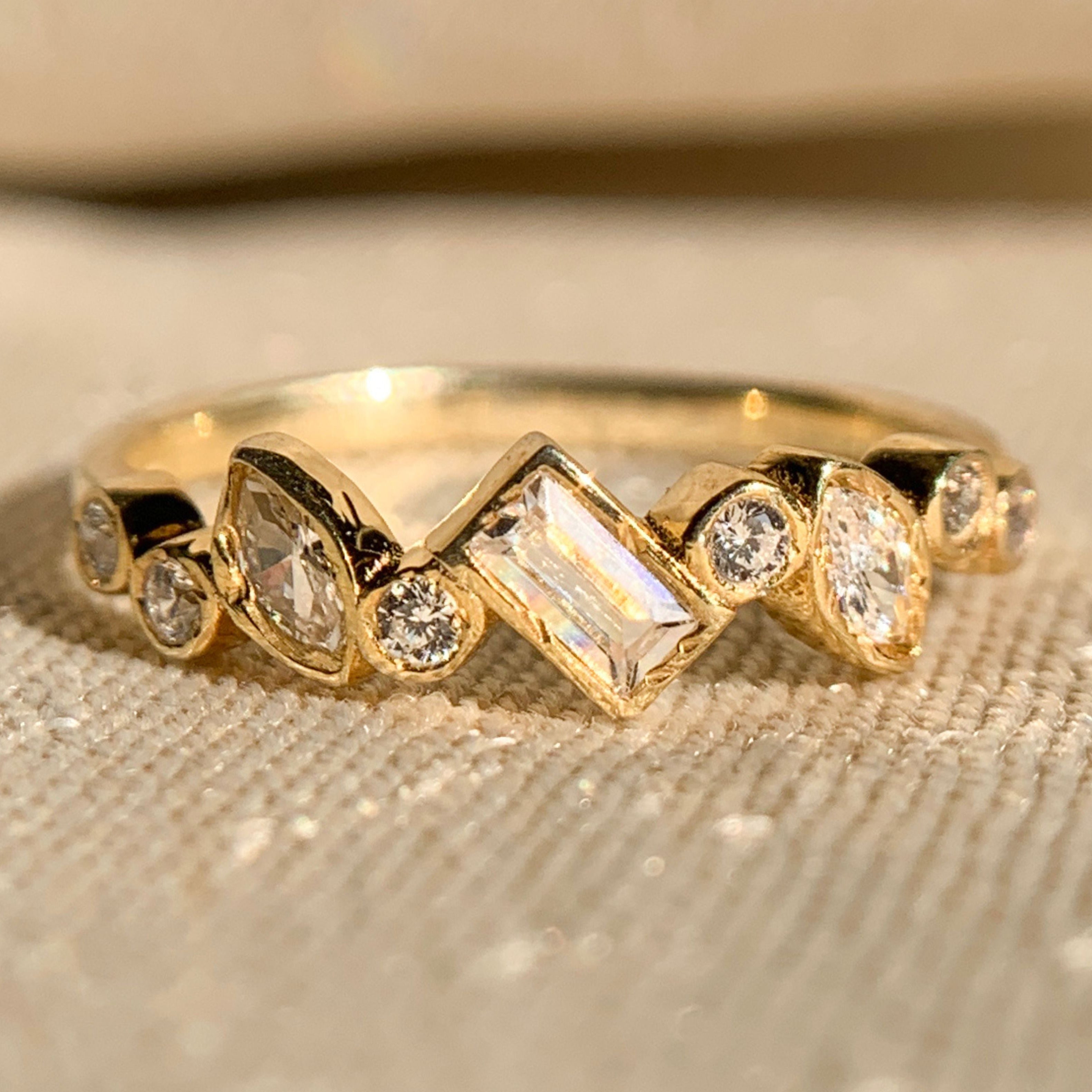 Elegant multi-shape bezel set diamond band in yellow gold